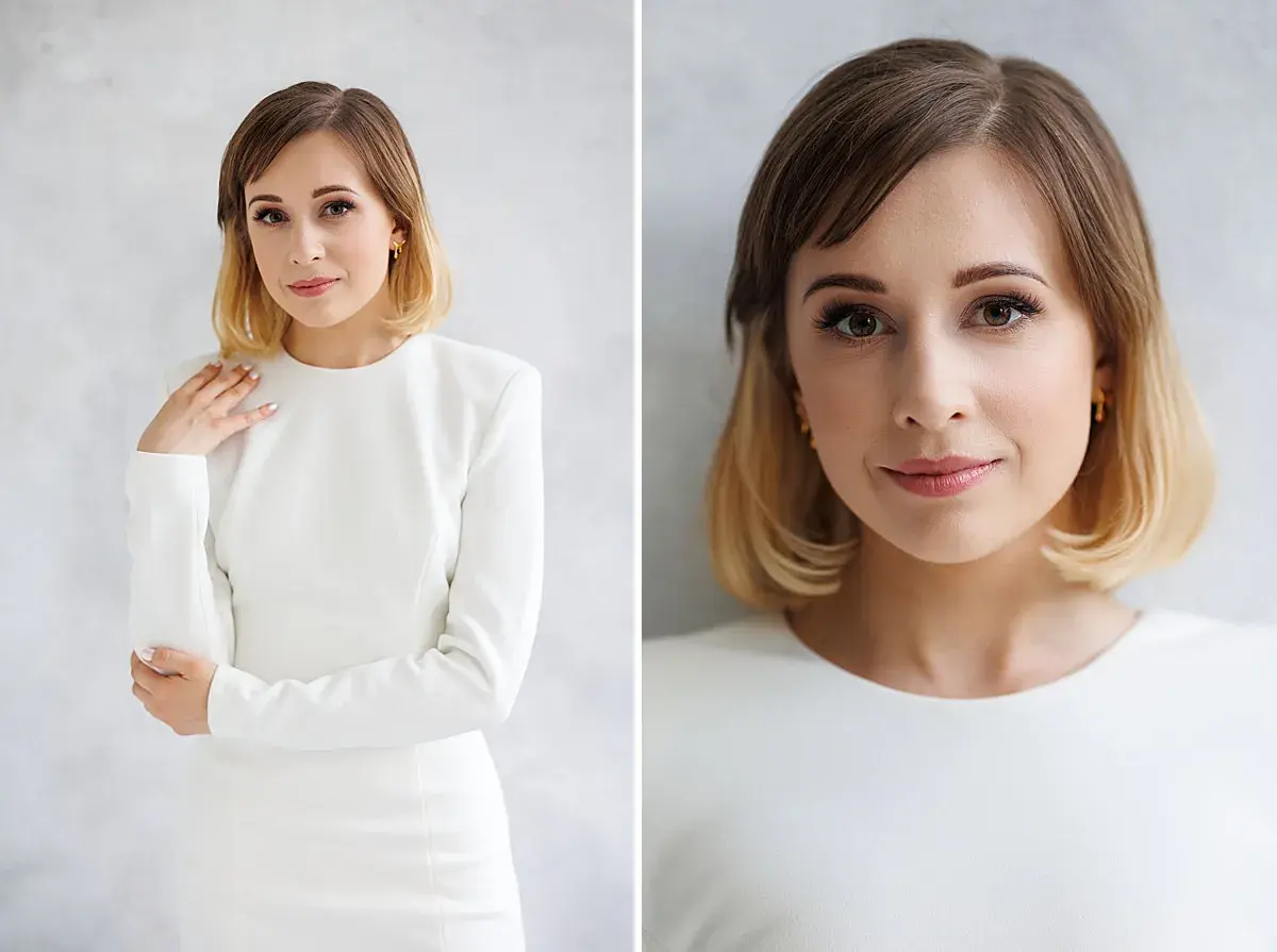 Elegancka kobieta w białej sukience, subtelnie dotykająca ramienia. Idealny przykład, jak pozować do zdjęć, by wyglądać naturalnie i pewnie.