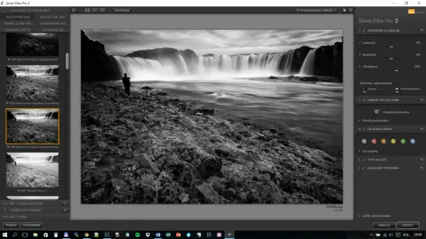 Czarno-biały wodospad z sylwetką fotografa, edytowany w programie z darmowe filtry photoshop.